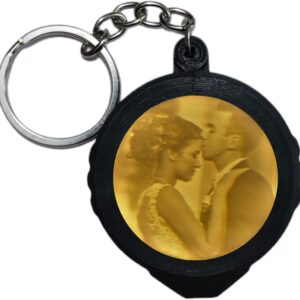 3D printed custom portrait keychains displayed on a white surface with detailed facial features.