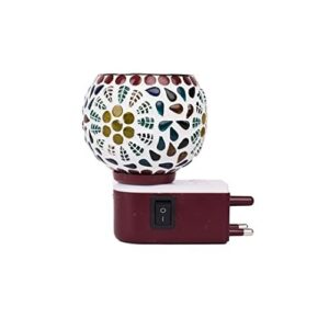 Camphor diffuser night lamp glowing softly with a stylish, modern design placed on a bedside table.